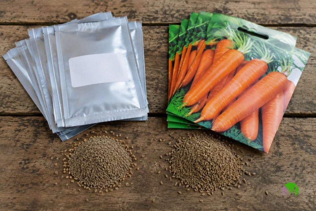 Cheapest vegetable seeds UK, plain foil seed packets beside branded packets with seeds poured out
